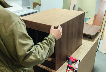 Staples, for a pneumatic stapler, in a carpentry workshop