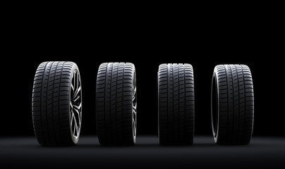 Set of wheels with modern alu rims on black background © Photocreo Bednarek