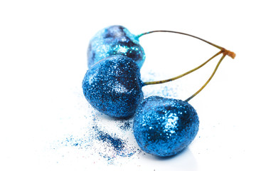 Cherry berries covered with a colorful glitters