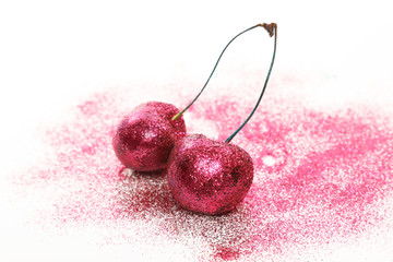 Cherry berries covered with a colorful glitters