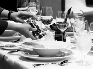 Table side service at a fine dining restaurant, Waiter serving dishes to the table