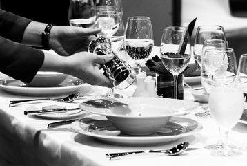 Table side service at a fine dining restaurant, Waiter serving dishes to the table