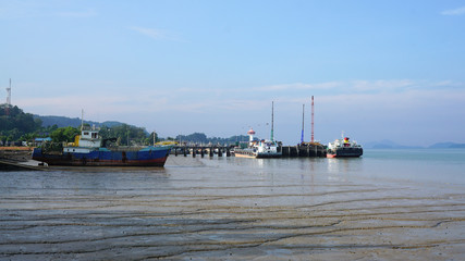 Panorama view of the port and logistic ship with beautiful ocean background