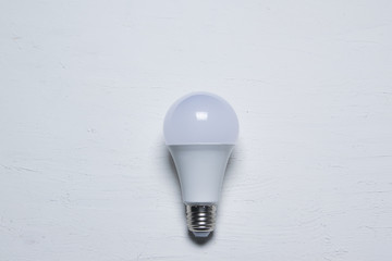 Led bulb isolated against a white background. Home automation and power saving concept with empty copy space.