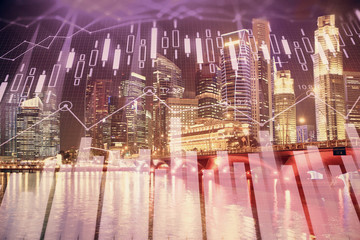 Financial chart on city scape with tall buildings background multi exposure. Analysis concept.