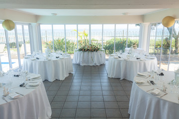 A small hall decorated for a wedding reception