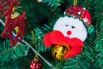 Close-up of decorations on christmas tree during christmas time at home.