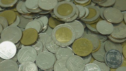 Stacks of silver and gold coins background. The concept of rising inflation.
