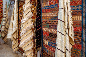 Moroccan  carpets in the street shop souk of Asilah, Morocco