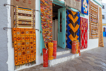 Moroccan  carpets in the street shop souk of Asilah, Morocco