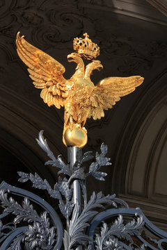 Double-headed eagle guarding the patterned wrought-iron gate of the Hermitage in St. Petersburg, Russia