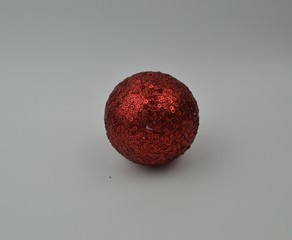  red christmas ball lies on a white background