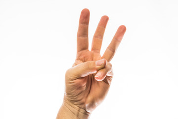 Three fingers pointed upward, isolated on a white background. Communicating by hand signal.