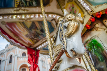 Novi Sad, Serbia - December 13. 2019: Downtown Novi Sad. The decorations on the children's carousel with wooden horses