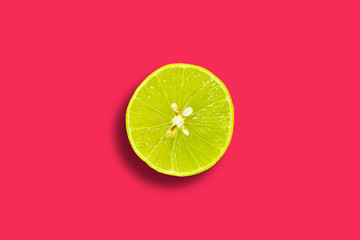 Half lemon flat lay in center on a vivid red background