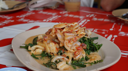 Spicy phukud vegetable salad with shrimp and squid serving with sweet and sour coconut sauce