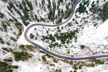 Foto op Aluminium Snowy rural road aerial view. © erika8213