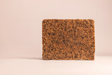 Natural soap with coffee and cinnamon on a white background. Eco coffee scrub, spa skin care. Vegan...