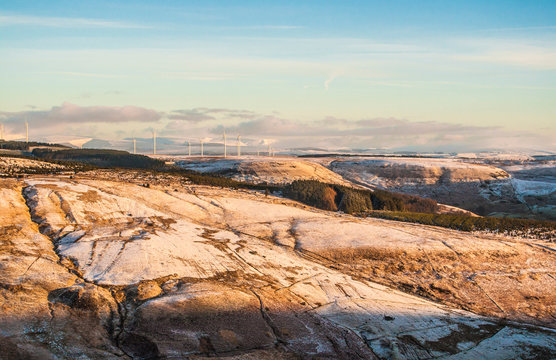 Mountain range covered by snow in the morning light near Treorchy, Wales