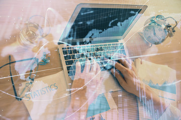Multi exposure of forex graph with man working on computer on background. Concept of market...
