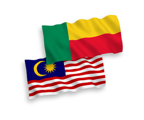 National vector fabric wave flags of Benin and Malaysia isolated on white background. 1 to 2 proportion.