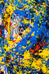 abstract expressonism. Picture painted using the technique of dripping. Mixing different colors red yellow blue white black. Vertcal orientation.