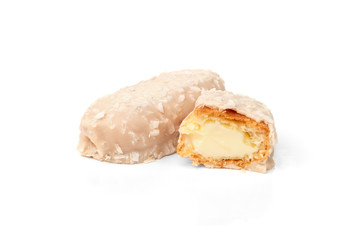 Coconut eclairs or custard cookies isolated on white background.