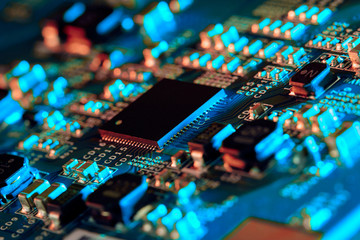 Electronic circuit board with electronic components such as chips close up. The concept of the electronic computer hardware technology.	