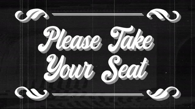 animation of words please take your seat of a vintage cinema film