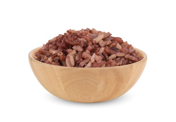 brown rice in the wooden bowl isolated on white background