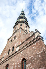 Fototapeta na wymiar tower of a medieval gothic church, St. Peter's Basilica, Riga, Latvia