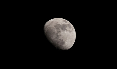 moon in the black sky. view from Earth with telephoto zoon lens