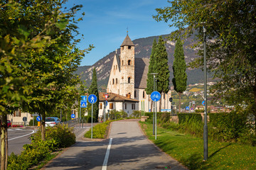 Beautiful scenery of Trento city with Saint Apollinare church at Adige river, Northern Italy