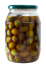 Glass jar with delicious whole olives at wooden table