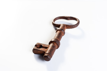  old rusty key from an old padlock lie on a white background