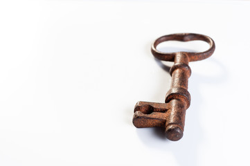  old rusty key from an old padlock lie on a white background