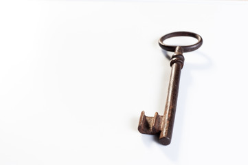  old rusty key from an old padlock lie on a white background