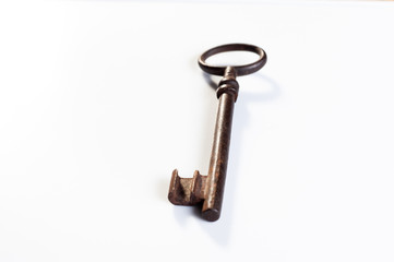  old rusty key from an old padlock lie on a white background