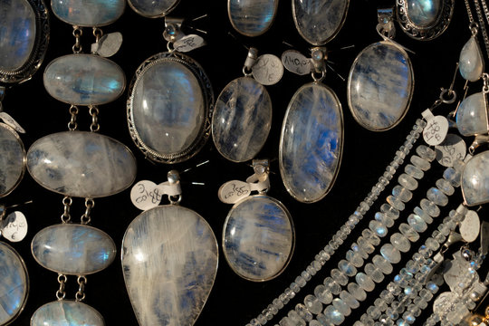 Rainbow moonstone necklage earrings jewelry on display stand in a shop market