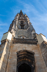 Bordeaux, France. View of the bell tower of the Basilica of San Michele, in the enchanting UNESCO World Heritage city, famous for its fine wines, produced in vineyards along the wine route.