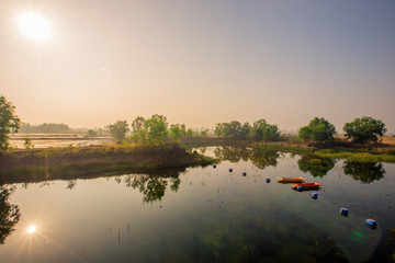 Blurred abstract background of nature, panoramic views in natural marshes, with small boats (kayaks) for fish to survive, with clear skies during the day