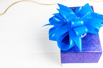 cardboard box on a white background. decorated with a bow. close-up.