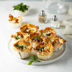 Pumpkin cheese tarts with basil