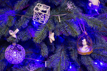 White Christmas tree decorations with blue garland