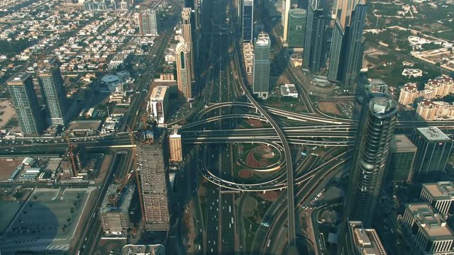 Aerial hyperlapse of a major city highway interchange traffic. Dubai, UAE