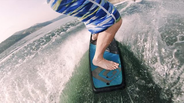 Ride Along POV of Man Riding Skate Wakeboard Close Up