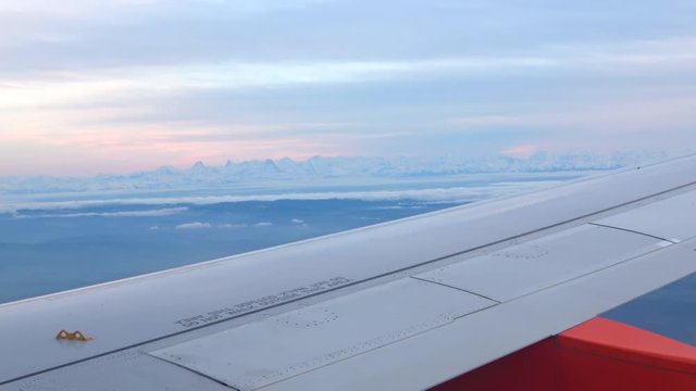 View of swiss alps from plane passenger window 