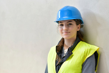 Young apprentice with security helmet, isolated on background