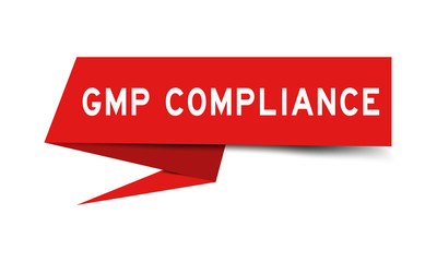 Red color paper speech banner with word GMP (Abbreviation of good manufacturing practice) compliance on white background