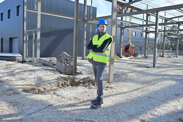 Apprentice standing on construction site